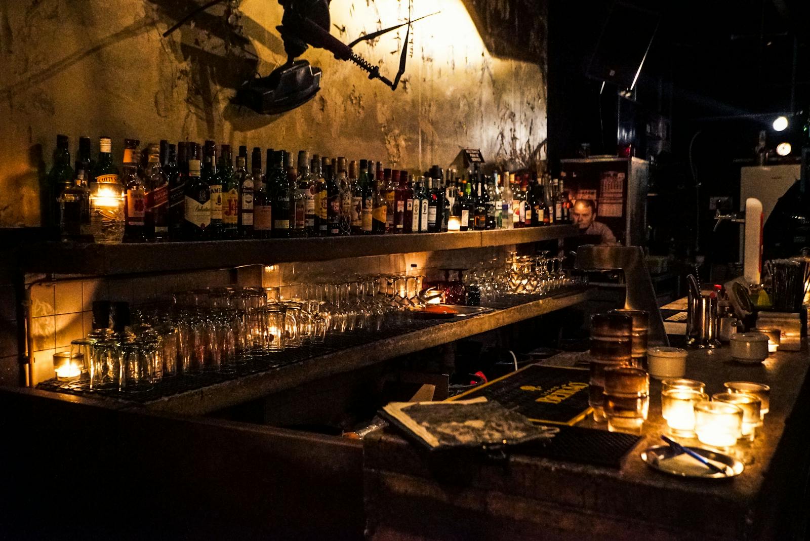 Person Sitting Near Bottles