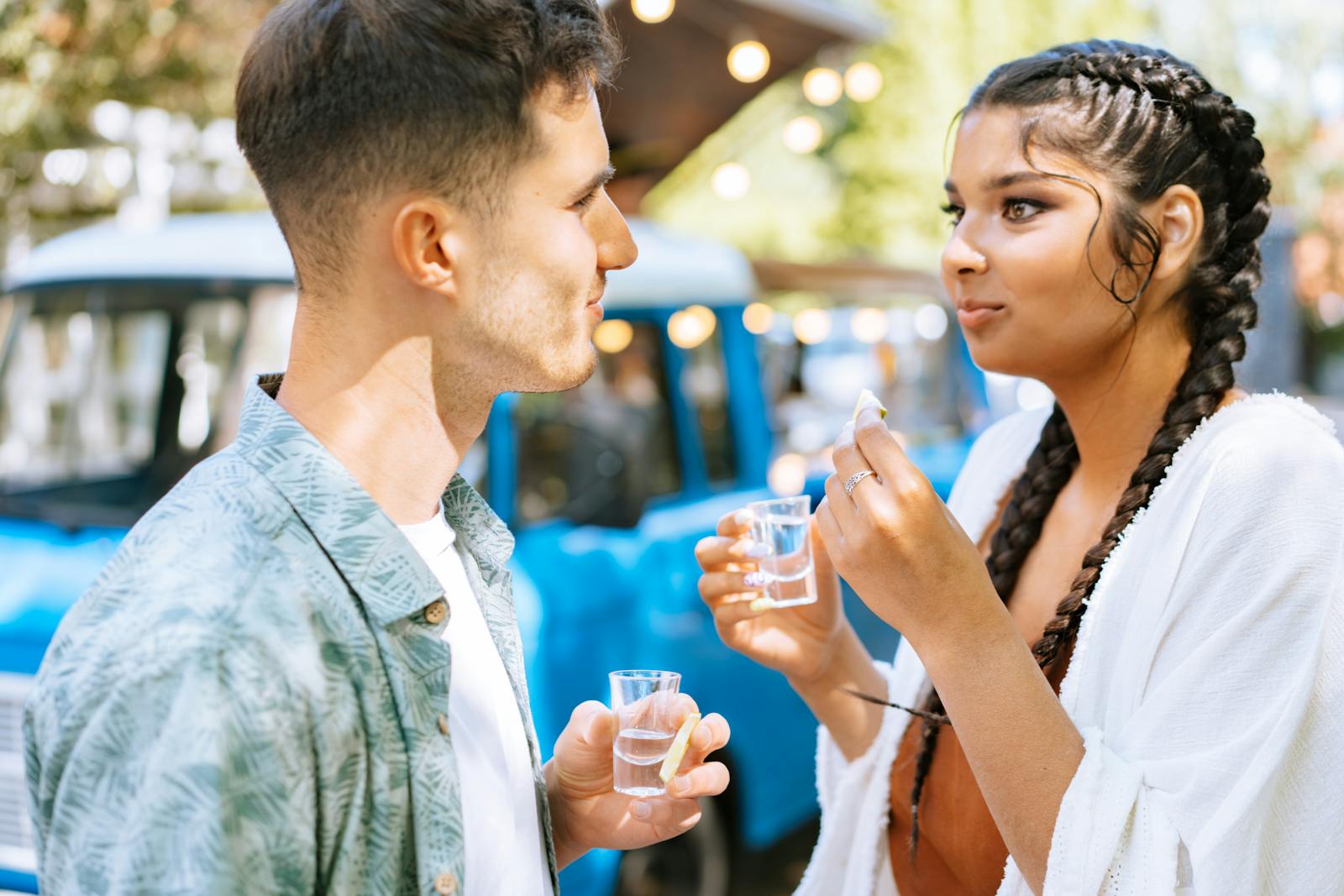 A Man and a Woman Drinking Tequila